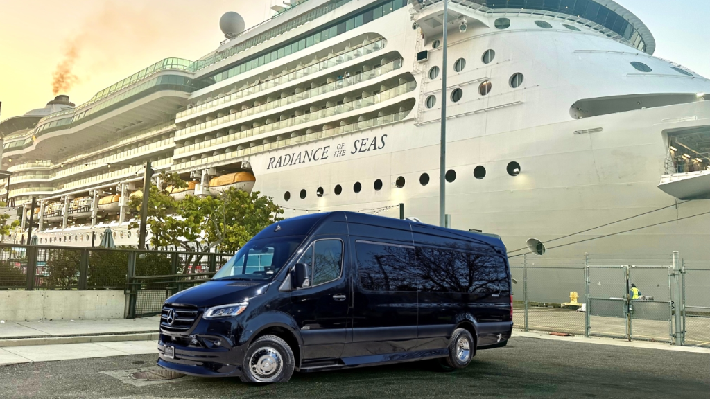 A black Mercedes-Benz van parked near the cruise ship 'Radiance of the Seas' at a port, showcasing luxury transportation options.